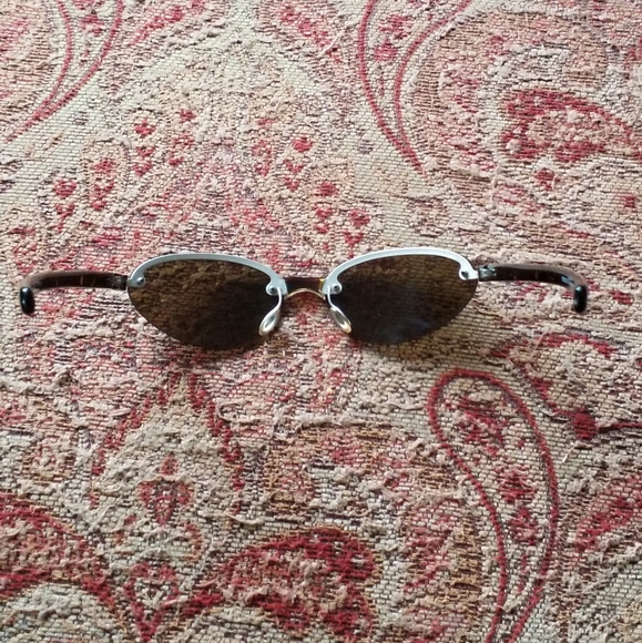 PRADA Sunglasses Model:PRADA SPR 10B Frame Color:Brushed Matte Silver Tortoise - Picture 10 of 13